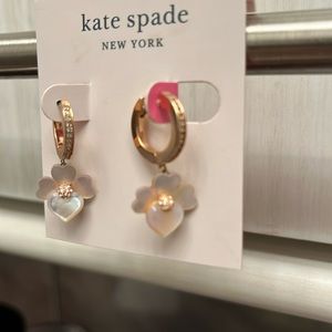 Kate Spade rose gold, colored Huggies with mother of pearl floral drops.